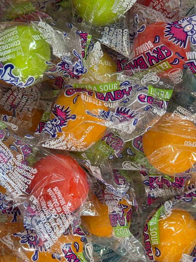 Vibrant Cry Baby gumballs: round, colorful, extra sour bubble gum in character wrappers