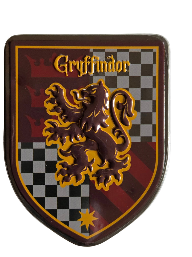 Glossy Gryffindor crest tin with raised lion on checkered background