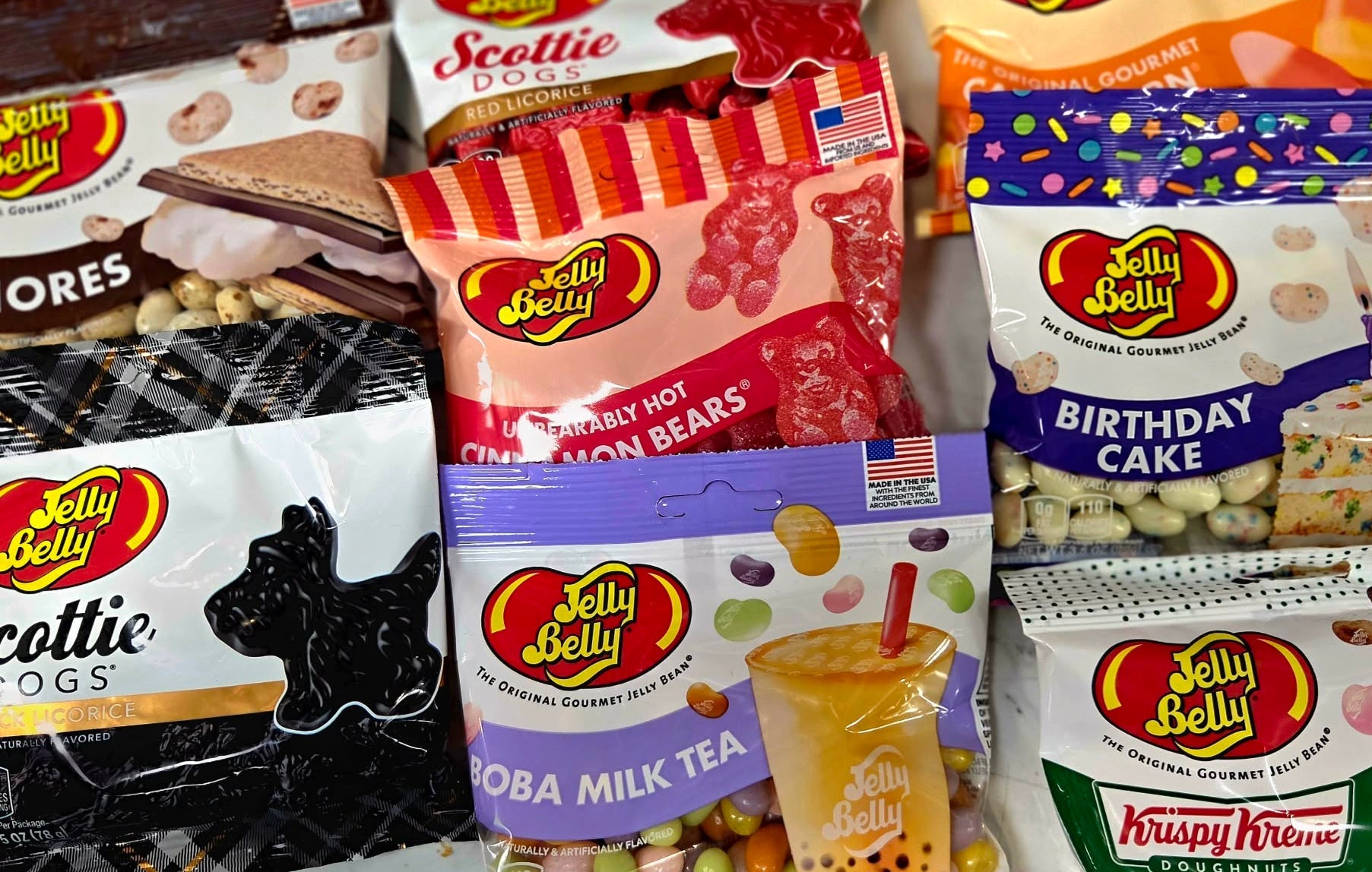 Rainbow-striped shelf of colorful Harry Potter candies in Jelly Belly pack