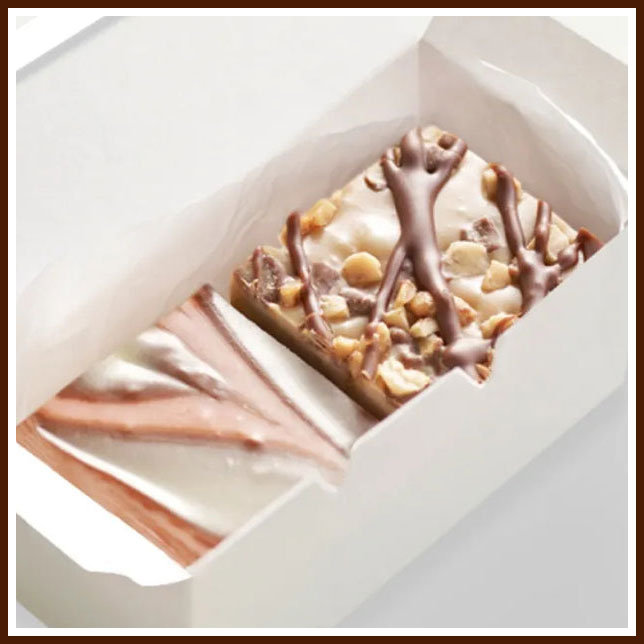 Two-piece fudge box with swirled white-milk chocolate bar and peanut-drizzled dark chocolate bar
