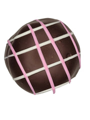 Cherries Jubilee Truffle 1.5oz: glossy dark chocolate with pink white grid icing