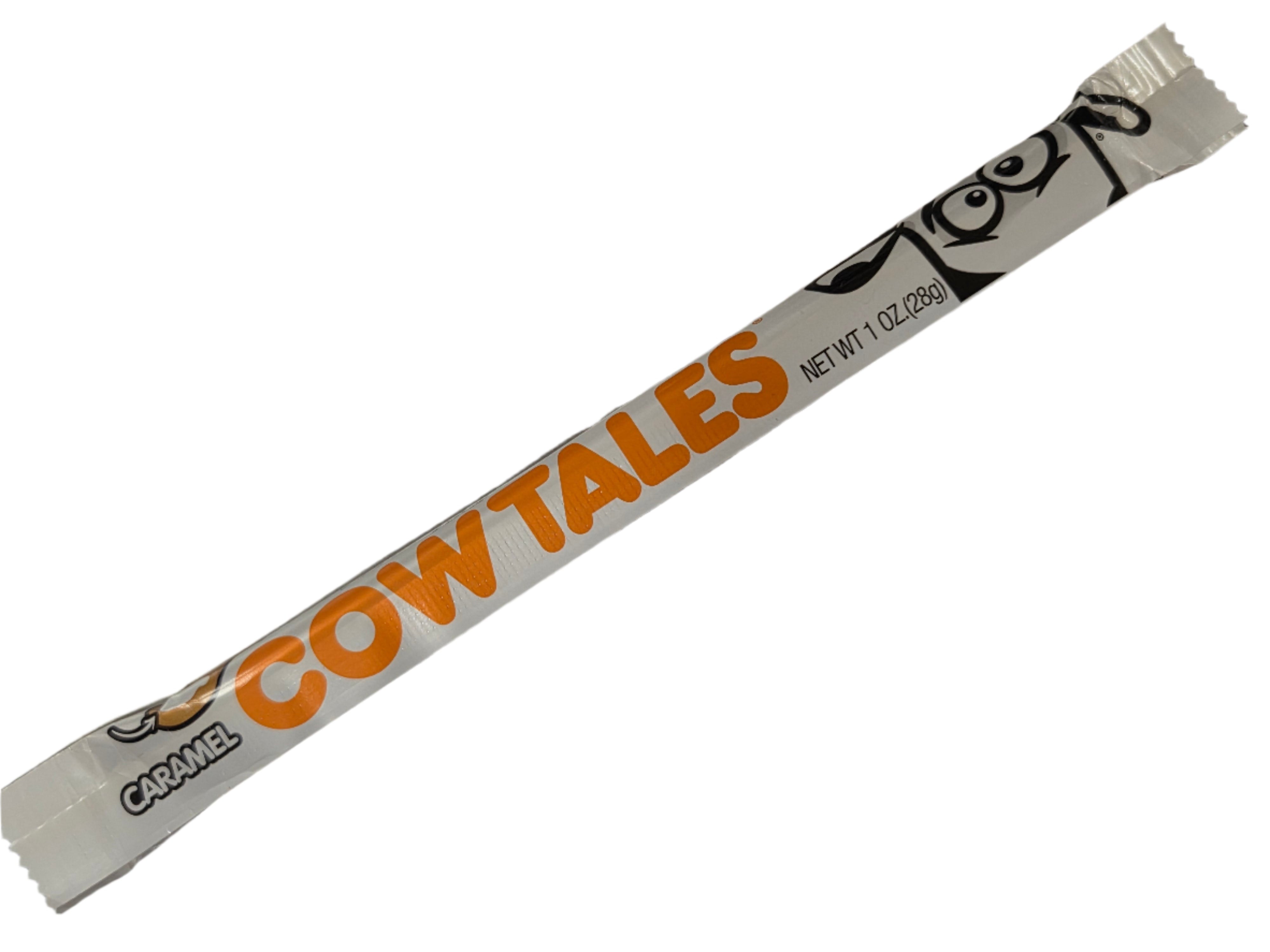 Cow Tales Vanilla Bar: glossy white wrapper with orange logo and black cow illustration