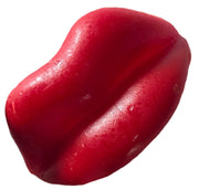 Vibrant red glossy Wack-o-Wax Lips soap with smooth translucent surface