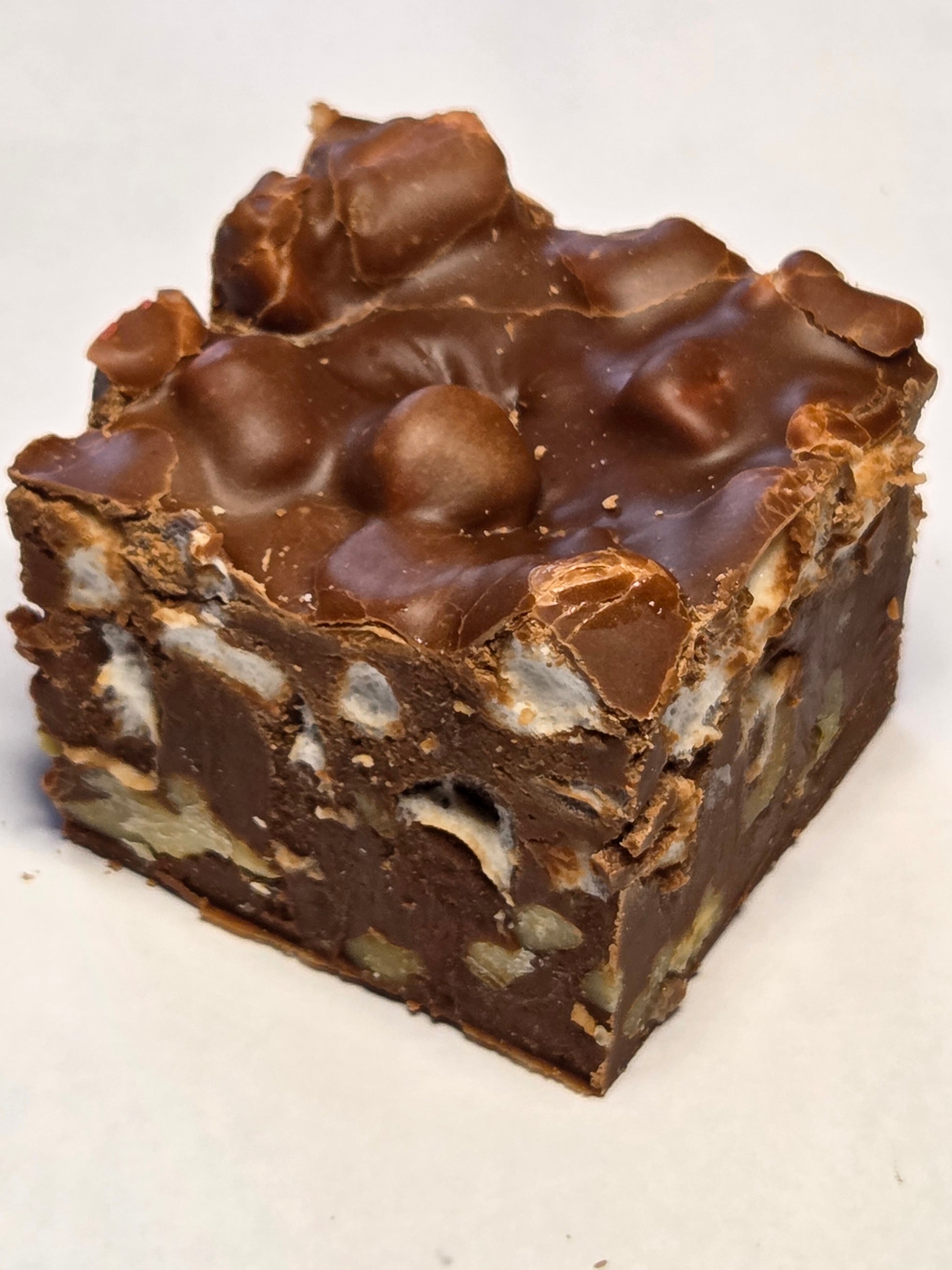 Rocky Road Fudge: square chocolate bar with nuts, marshmallows, caramel