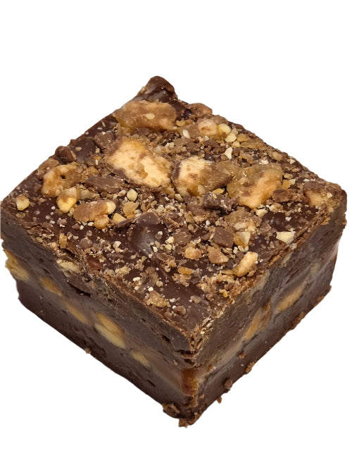 Snickers fudge square with nuts, caramel in dark ganache