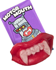 Red glossy plastic vampire mouth clip with purple motor mouth card in Wack-o-Wax Fangs