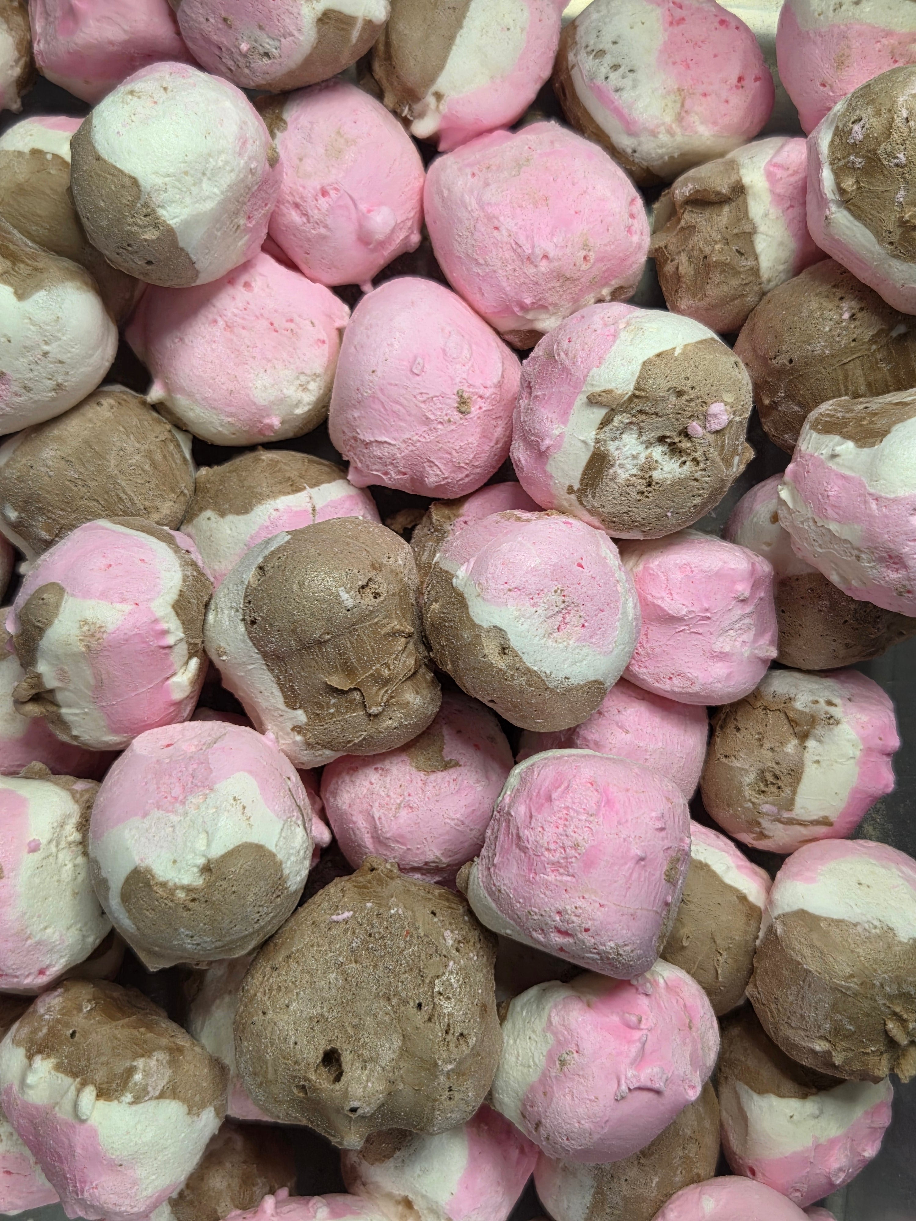 Pink and brown fluffy marshmallow candies in Crazy Bites Neapolitan Taffy