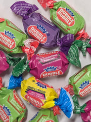 Colorful Dubble Bubble Fruit Flavors gum, individually wrapped in vibrant packaging