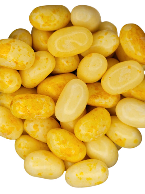 Pile of glossy yellow Jelly Belly Buttered Popcorn jelly beans