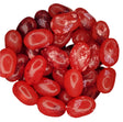 Pile of glossy red Jelly Belly Pomegranate jelly beans with sugary coating