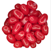 Pile of glossy red Jelly Belly Very Cherry jelly beans with white swirls