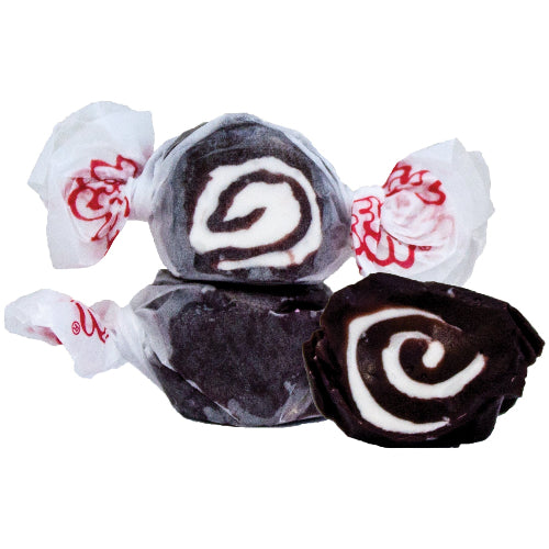 Dark chocolate swirl taffy candies in Taffy Licorice Swirl, wrapped in white paper with red branding