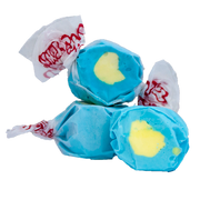 Taffy Passion Fruit: blue and yellow swirl candy in white paper with red lettering