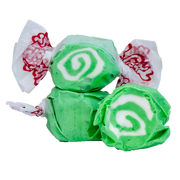 Green and white swirled Taffy Key Lime candies in decorative wraps