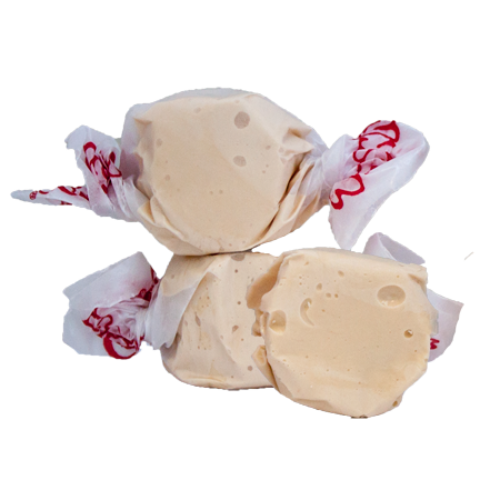 Cream-colored glossy Taffy Honey candies wrapped in white paper with red cursive lettering