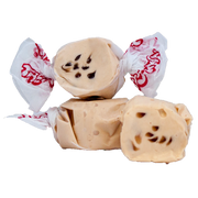 Cream-colored chocolate-filled taffy candies in Taffy Chocolate Chip Cookie wraps