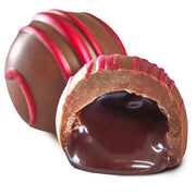 Rich glossy dark chocolate milk red velvet truffle with red drizzle and molten center