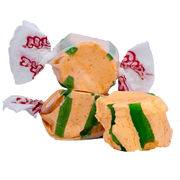 Yellow and green striped Taffy Chili Mango taffy in white paper with red branding