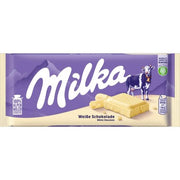Milka white chocolate bar in purple and cream wrapper with cow illustration