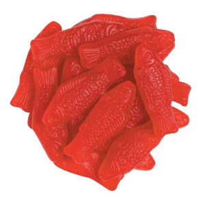 Pile of bright red glossy Swedish Fish gummy candies with scales and fins
