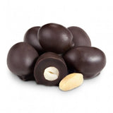 Double-dipped dark chocolate-covered peanuts, one sliced to show creamy interior