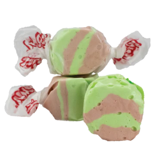 Green and pink striped taffy in Taffy Dirty Soda product, wrapped in white paper with red lettering