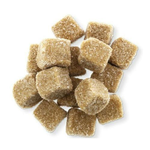 Brown crystalline licorice cubes Griotten with coarse sugar texture