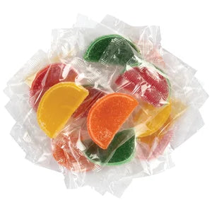 Assorted fruit slice jellies: colorful citrus gummy candies in clear packs