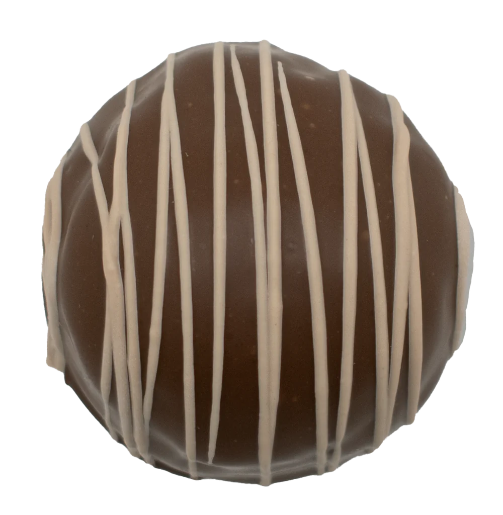 Maple Walnut Truffle 1.5 oz round chocolate with dark brown coating and white drizzle