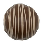 Maple Walnut Truffle 1.5 oz round chocolate with dark brown coating and white drizzle