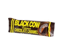 Black Cow chocolate caramel bar in glossy brown and yellow wrapper