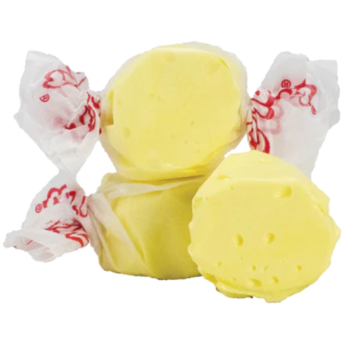 Yellow Taffy Butter candies wrapped in white paper with red dragon designs