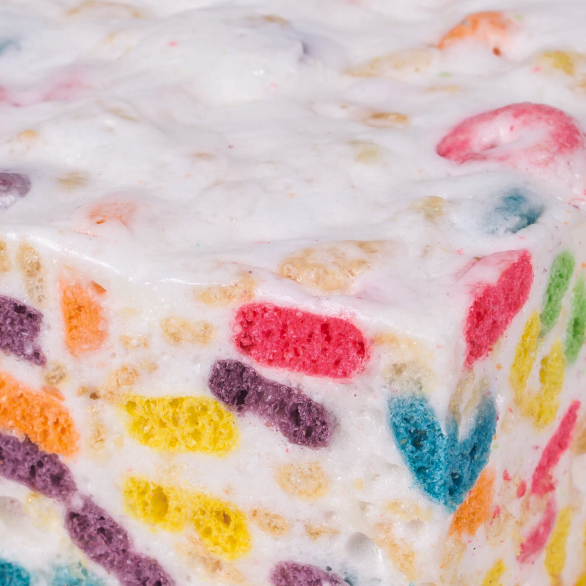Colorful Crispery Fruity Ringlets Crispycake with rainbow cereal in white frosting