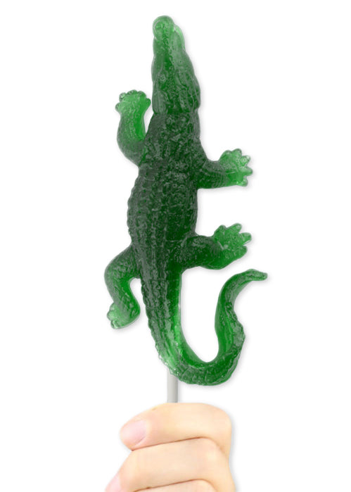 Translucent green gummy crocodile lollipop on a stick, Gummy Gator Pop