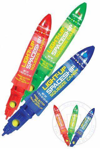 Light-up spaceship squeeze candy crayons in red, green, blue rocket design