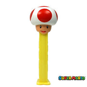 Yellow PEZ Super Mario Super Mushroom toad dispenser with red-capped mushroom