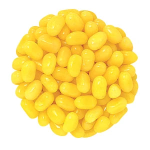 Pile of bright yellow glossy Jelly Belly Pina Colada jelly beans