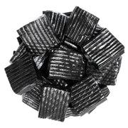 Pile of black ridged Finnska Licorice Ripples gummy candies