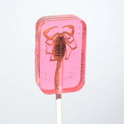 Translucent pink Hotlix Scorpion Sucker lollipop with amber scorpion inside