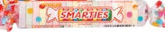 Pink and white Smarties Mega Roll wrapper with colorful playful design