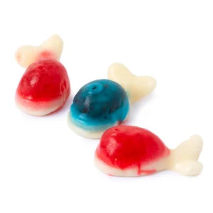 Three translucent candy-colored Whales Gummies fish with white tails and red or blue bodies